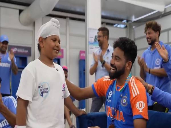 Mohammed Siraj with young fan (Photo: BCCI)