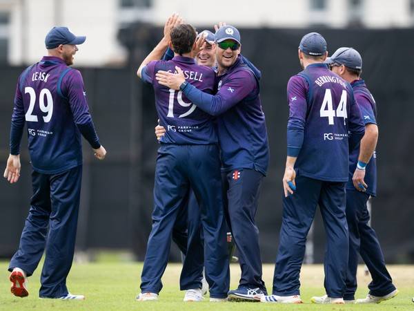 Charlie Cassell celebrating with Scotland players (Photo: Scotland Cricket/X)