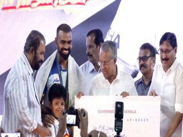 Pinarayi Vijayan honours P R Sreejesh. (Picture: ANI)