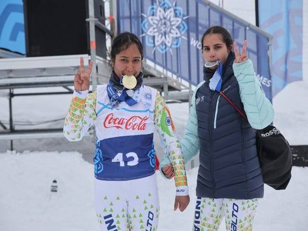 Indian Alpine Skiing athletes Nirmala Devi and Radha Devi pose with their medals